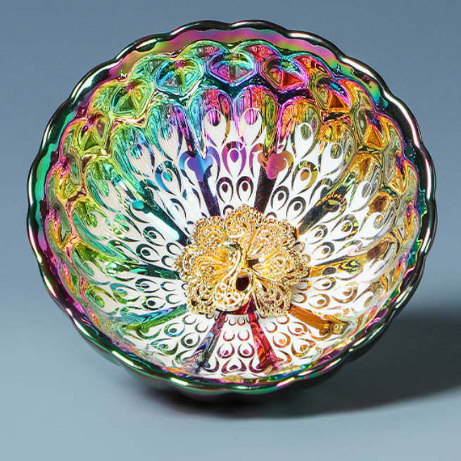 Kiln-Transformed Seven-Color Peacock Tea Cup — top view showing iridescent peacock feather pattern
